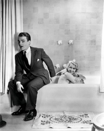 https://static.tvtropes.org/pmwiki/pub/images/blonde_crazy_1931_001_cagney_in_suit_by_blondell_in_bath_00m_zhg.jpg