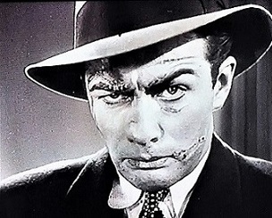 https://static.tvtropes.org/pmwiki/pub/images/screenshot_of_actor_robert_taylors_disfigured_character_in_buried_loot_1935.jpg